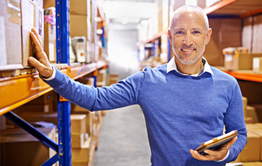 smiling man in warehouse