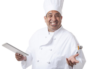 smiling chef holding tablet